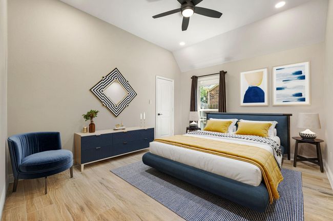 Secondary bedroom features wood like tile flooring, neutral paint, dark stained ceiling fan with lighting and a large window with privacy blinds. | Image 28