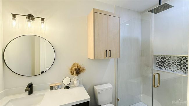 Full bathroom featuring a stall shower and vanity | Image 15