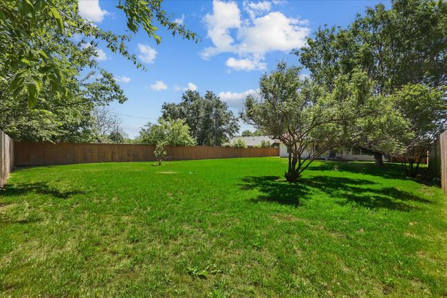 View of yard with a fenced backyard | Image 34