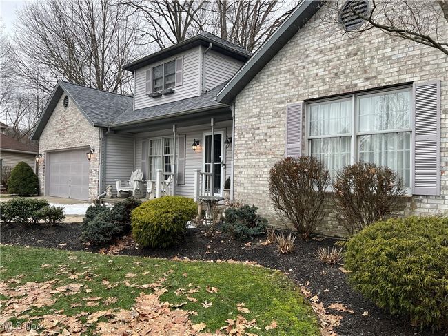 Brick front of house and 2-car attached garage | Image 46