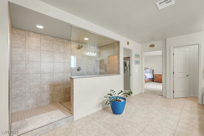 Full bathroom featuring walk in shower, tile patterned flooring, and recessed lighting | Image 35