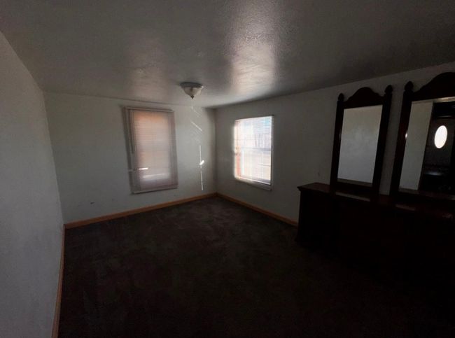 Carpeted spare room featuring baseboards | Image 13