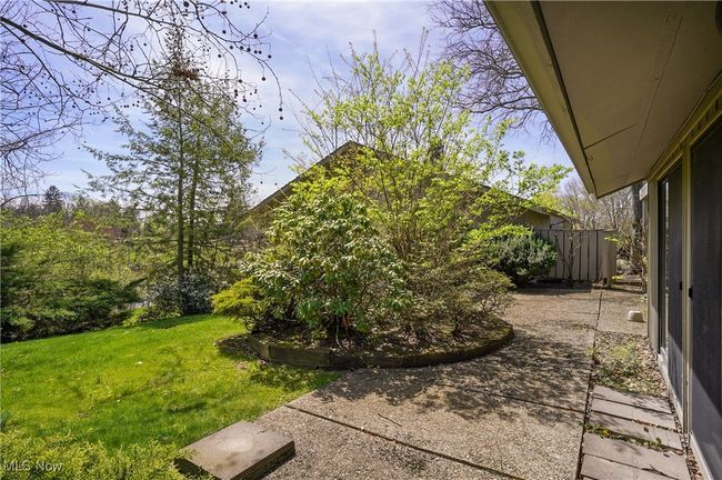View of yard with a patio and fence | Image 13