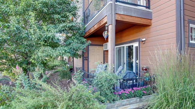 Back Patio offers privacy and comfort. Fenced in for a small dog, pull down shades for the late summer months. Beautiful sunsets. Secure storage closet located off patio. | Image 31