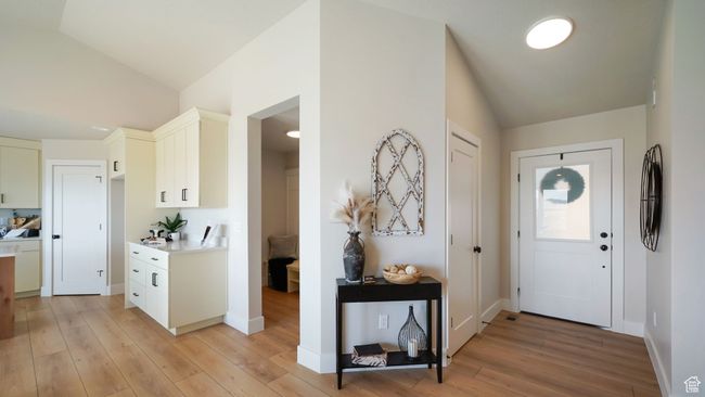 Entryway featuring lofted ceiling and light wood-style floors | Image 4