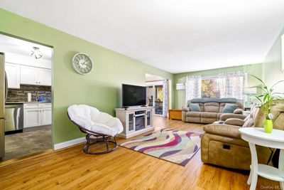 Living room featuring light hardwood / wood-style flooring | Image 3