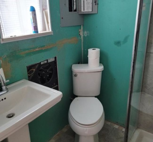 Bathroom with a stall shower and tile patterned floors | Image 4