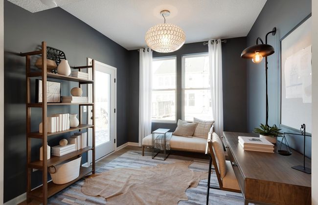 A welcome addition to any home.... This Ashton features our sunroom addition perfect for a home office, den, reading nook and any other uses you might have! Photo of model home. | Image 9