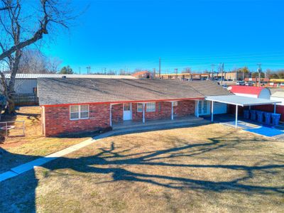 Rear view of property with a carport and a yard | Image 3