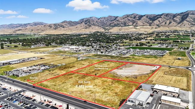 Aerial overview of property's location featuring a mountain backdrop and property boundaries highlighted | Image 16