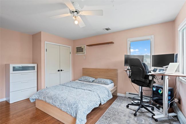 Workout area featuring recessed lighting, carpet flooring, wallpapered walls, and a wainscoted wall | Image 30