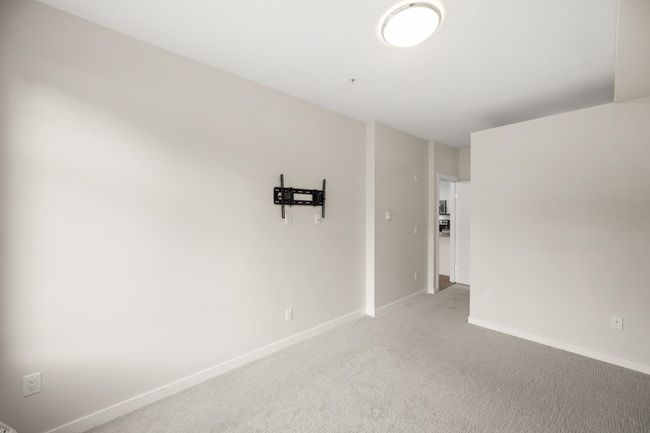 Unfurnished room featuring light carpet and baseboards | Image 24
