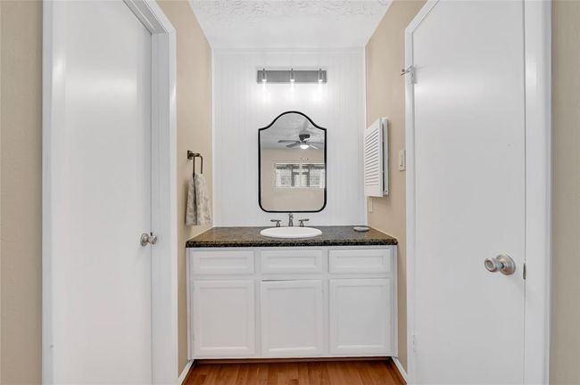 Elegant vanity area outside the shower offers added privacy. | Image 20