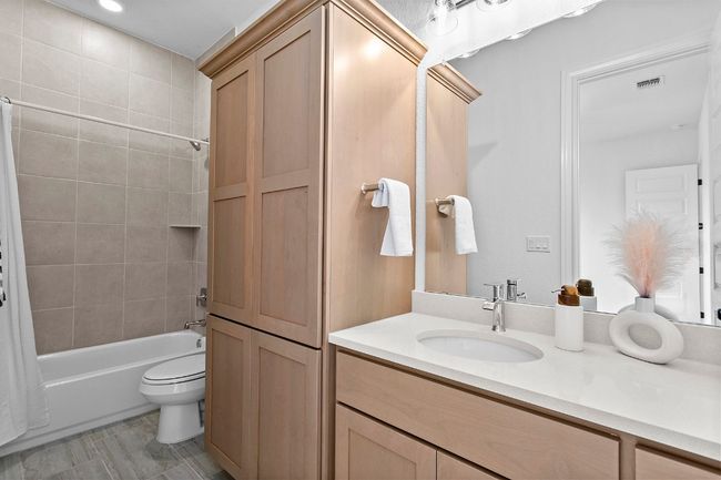 Bedroom 2 ensuite Full bathroom with vanity and shower / bathtub combination with curtain | Image 25
