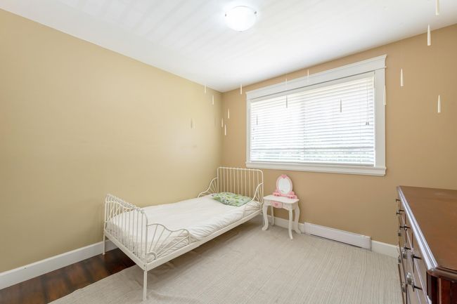 Bedroom with baseboards and a baseboard heating unit | Image 36