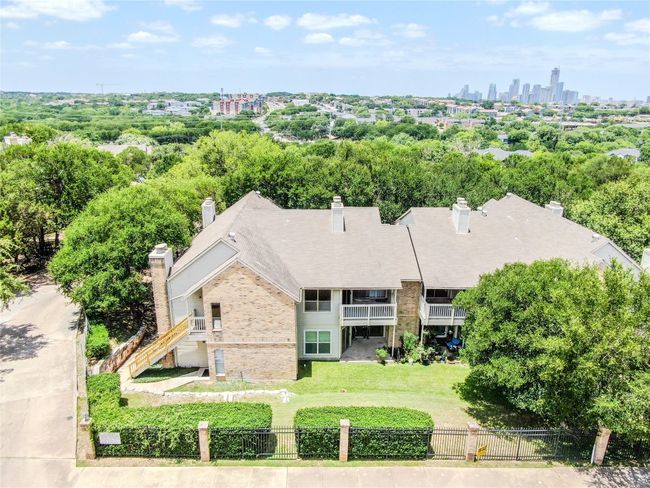 View of subject property featuring skyline and a tree filled landscape | Image 28