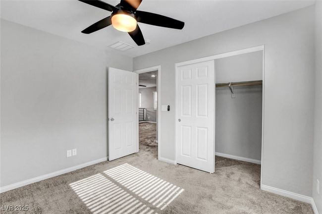 Unfurnished bedroom featuring carpet floors, a closet, and baseboards | Image 36