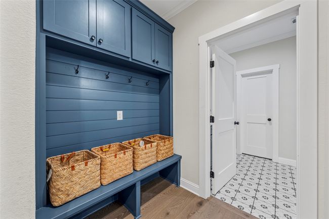Mudroom featuring light wood-type flooring, baseboards, and ornamental molding | Image 30