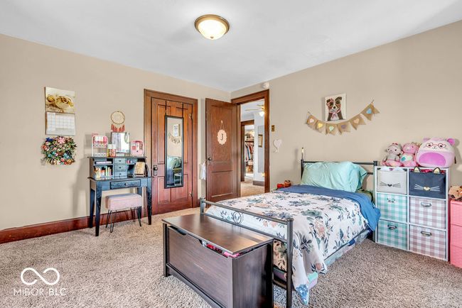 bedroom featuring carpet floors and baseboards | Image 39