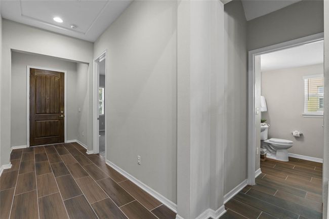 Front door and entrance to 5th Bedroom (1st floor) and entrance to 1/2 bath (1st floor) | Image 7