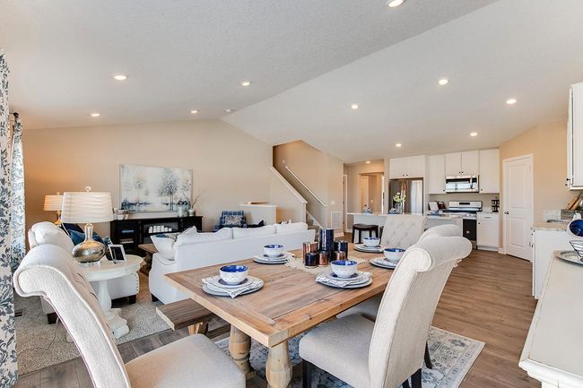 Spacious and well-lit dining area just off of the kitchen! Model home photo, colors and selections may vary. | Image 5
