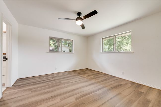 ceiling fan, healthy amount of natural light, and light wood-type flooring with Jack & Jill bath | Image 19
