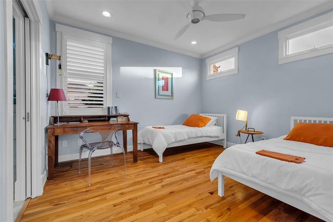 Spacious garage apartment bedroom with abundant storage. | Image 30