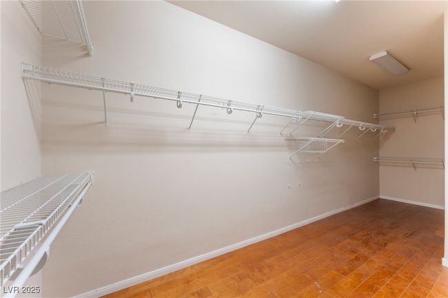 Walk in closet with wood finished floors | Image 33