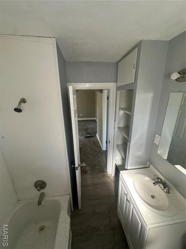 Bathroom with vanity, a textured ceiling, and wood finished floors | Image 4
