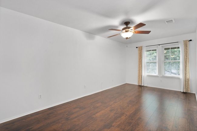 Spare room featuring wood finished floors and ceiling fan | Image 20
