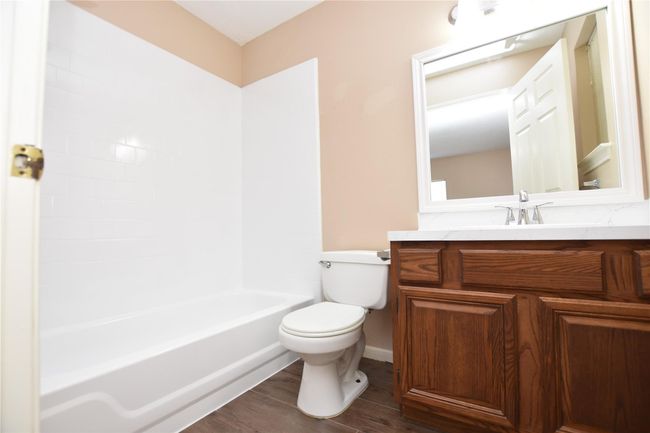 This primary en-suite bathroom is thoughtfully laid out to maximize functionality, with easy-to-maintain surfaces and a layout that ensures both comfort and convenience. | Image 17