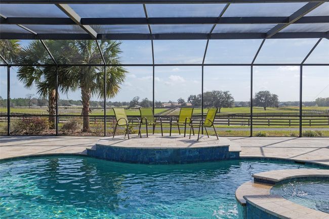 Elevated seating area with paddocks in background | Image 66