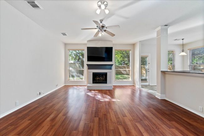 Beautiful open living area with lots of natural light and fireplace | Image 15