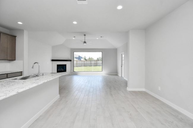 All of this overlooks your expansive family room, creating a perfect space for culinary delights and family gatherings. | Image 17