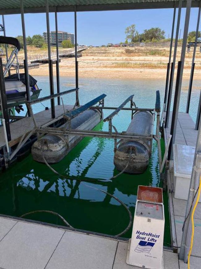Dock area featuring boat lift and a water view | Image 5