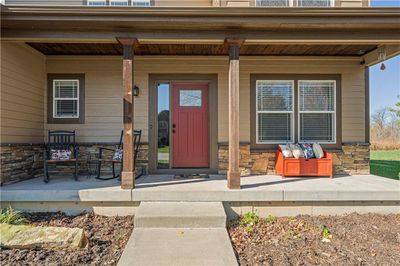 Large shady front porch is the perfect place to relax! | Image 3