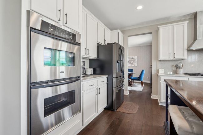 Kitchen features a double wall oven | Image 8