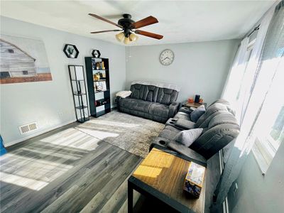 New paint and flooring in the living room. Tons of natural light! | Image 2