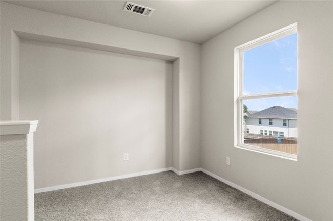 Carpeted spare room with plenty of natural light | Image 33