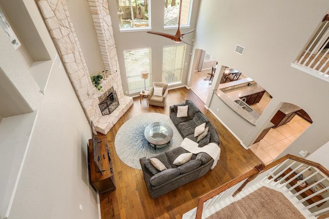 A wall of windows floods the living room with sunlight, creating a bright and airy atmosphere that draws you outside to the backyard every time you walk through the door | Image 15