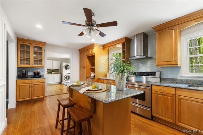 Kitchen looking toward laundry/pass through room | Image 13