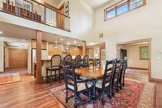 Dining room with plenty of natural light and a towering ceiling. | Image 17