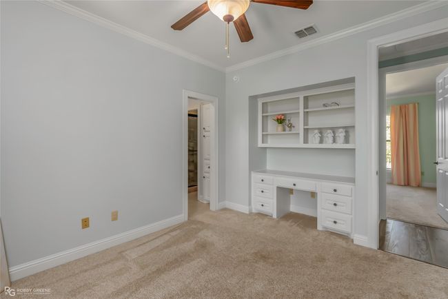 Large bedroom with large walkin closet, shelves and desk. | Image 24
