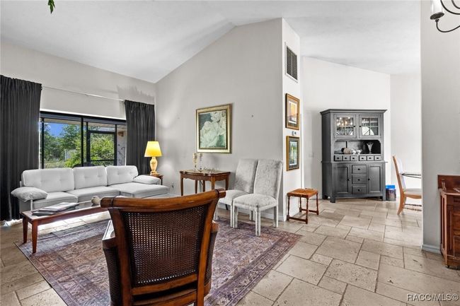 living room with view into the dining room | Image 11