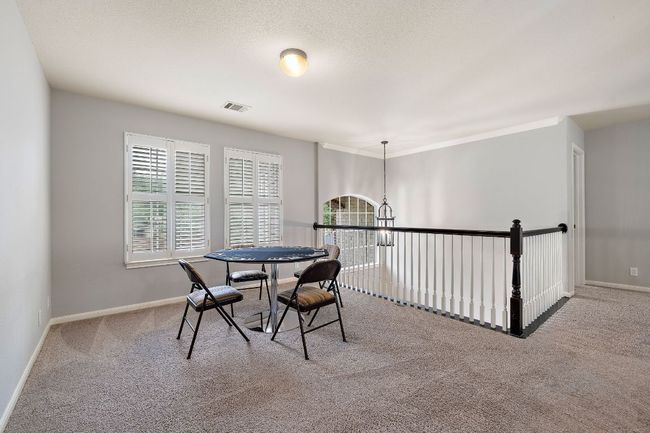 The upstairs bonus area is great for a game room or flex space! | Image 29