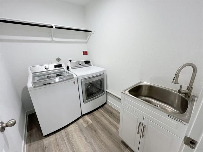 Laundry Room with a sink | Image 19