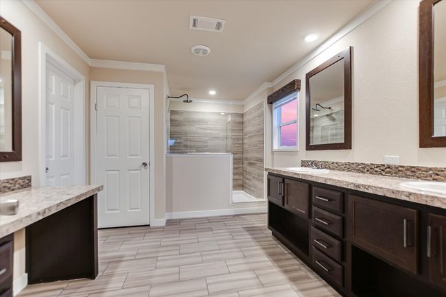 Full bathroom with crown molding, walk in shower, double vanity, and recessed lighting | Image 13