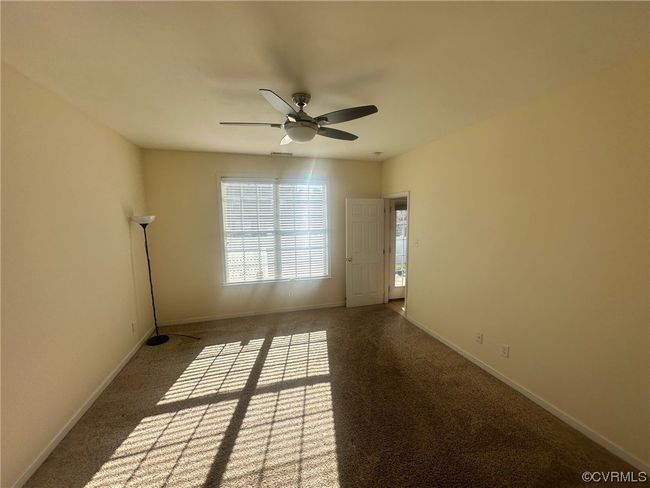 Carpeted spare room with ceiling fan | Image 17