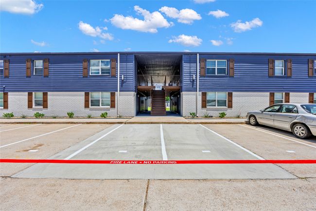 View of property with uncovered parking | Image 6