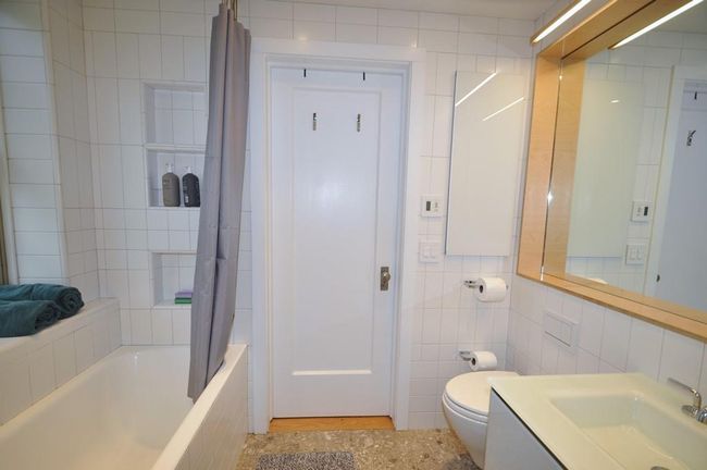 Renovated Bathroom has a soaking tub, floating vanity and has access to both the main bedroom and second bedroom. | Image 23